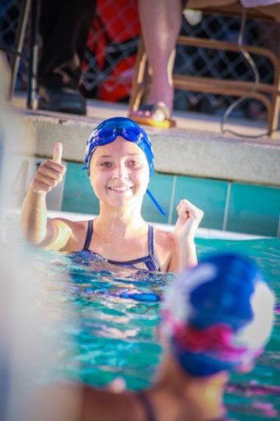 high school swimmer giving thumbs up